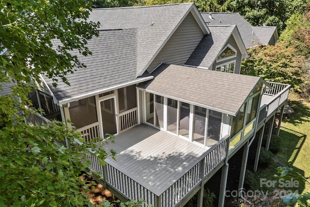 back of property featuring a sunroom