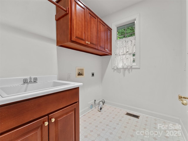 85 Tall Poplar Smt, Hendersonville, NC 28739 - laundry area featuring hookup for an electric dryer, cabinet space, hookup for a washing machine, and tile patterned floors