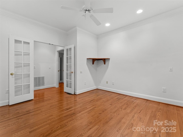 85 Tall Poplar Smt, Hendersonville, NC 28739 - empty room with ornamental molding, french doors, ceiling fan, wood finished floors, and recessed lighting
