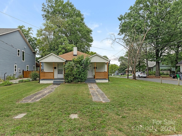 view of front of home featuring a porch and a front yard