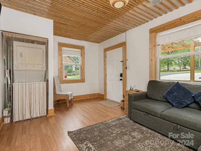 living room featuring wood-type flooring and wood ceiling