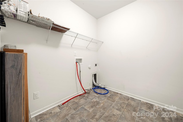 clothes washing area with hookup for a washing machine, hookup for a gas dryer, and electric dryer hookup