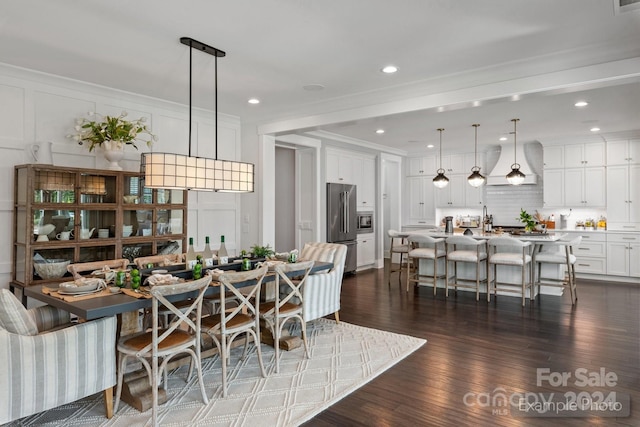 dining area with dark hardwood / wood-style flooring