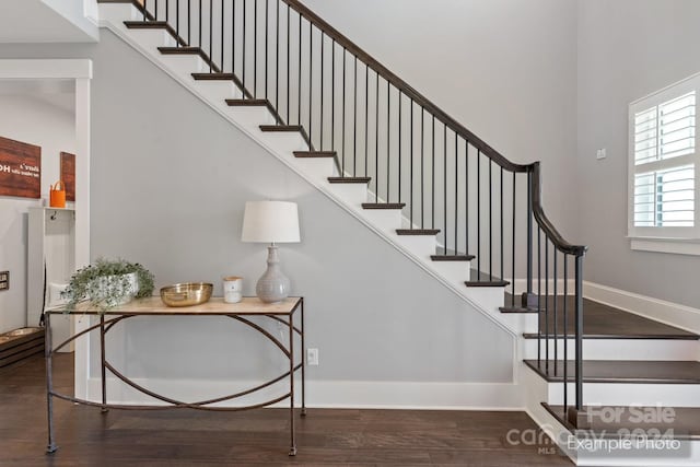 stairs featuring wood-type flooring