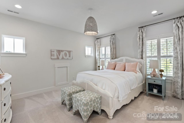 bedroom featuring light colored carpet