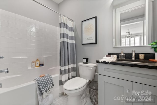 full bathroom with shower / bath combo with shower curtain, tile patterned floors, vanity, and toilet