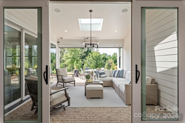 living room featuring a skylight