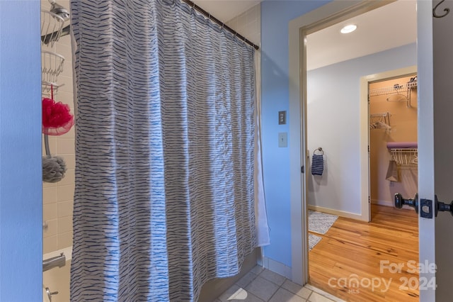 bathroom featuring hardwood / wood-style floors and curtained shower