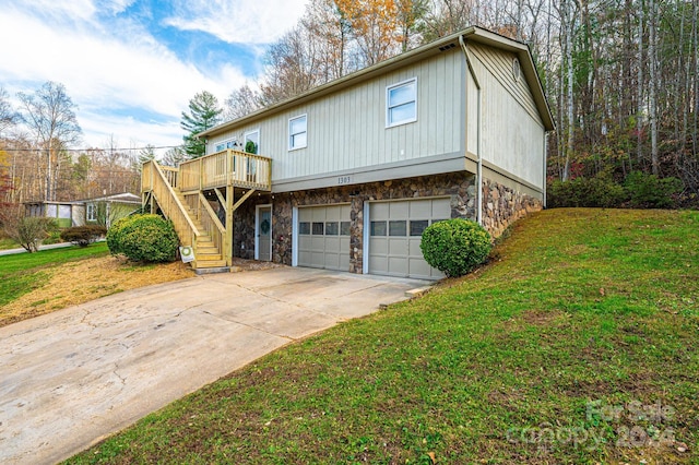 front facade with a front yard, a garage, and a deck