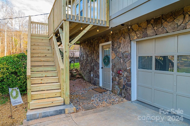 view of exterior entry featuring a garage