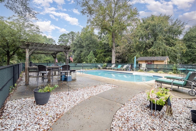 view of swimming pool featuring a pergola and a patio area