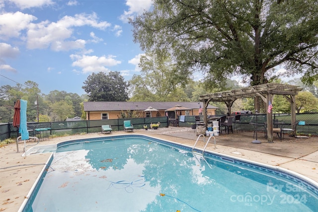 view of pool featuring a pergola and a patio area