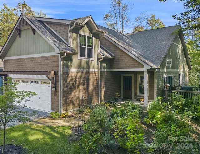 exterior space featuring a front yard and a garage