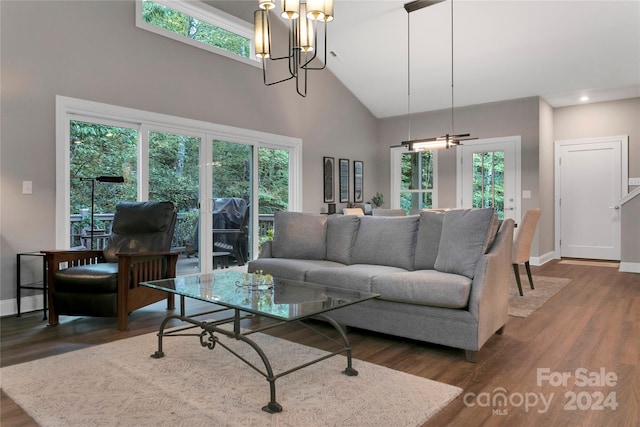 living room with dark hardwood / wood-style floors and high vaulted ceiling