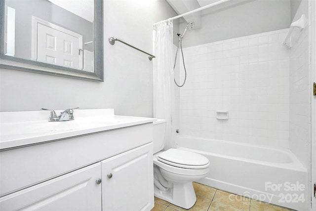 full bathroom with shower / bathtub combination with curtain, tile patterned flooring, vanity, and toilet