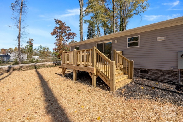 back of property with a wooden deck