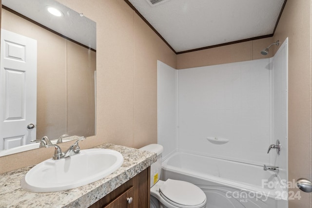 full bathroom with shower / tub combination, a textured ceiling, toilet, vanity, and crown molding