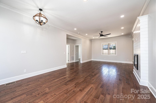 unfurnished living room featuring a fireplace, visible vents, baseboards, dark wood finished floors, and crown molding