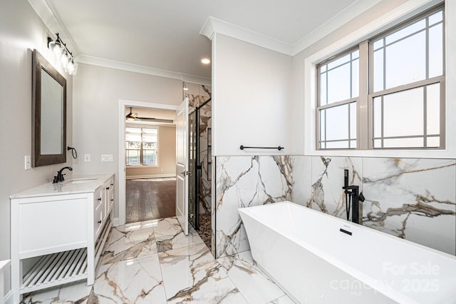 full bathroom featuring a marble finish shower, a soaking tub, ornamental molding, marble finish floor, and vanity