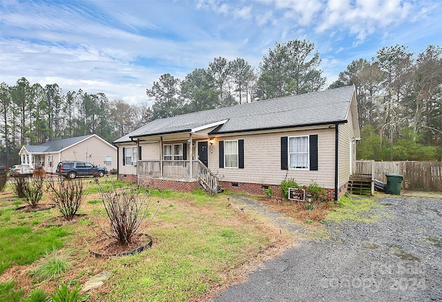 ranch-style home with covered porch