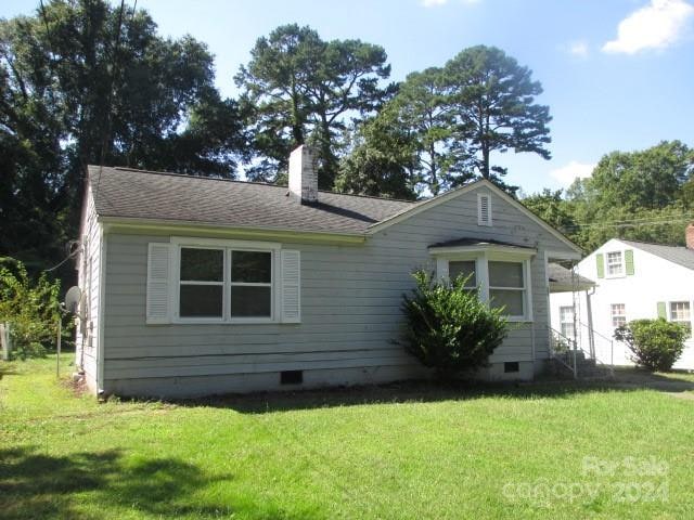 view of home's exterior with a yard