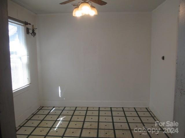 unfurnished room with ceiling fan