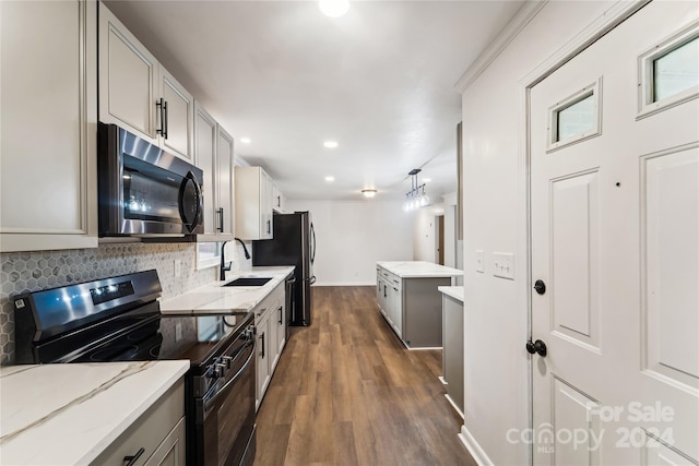 kitchen featuring dark hardwood / wood-style floors, black electric range, sink, gray cabinetry, and decorative backsplash