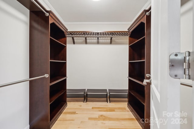 spacious closet featuring hardwood / wood-style floors