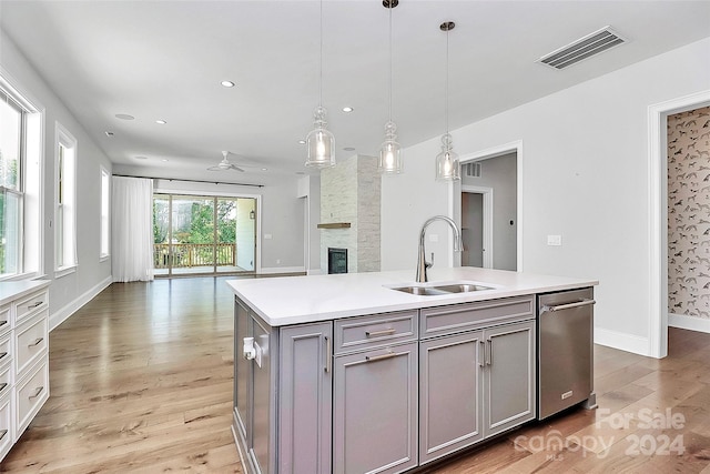 kitchen with gray cabinets, ceiling fan, hardwood / wood-style floors, and sink