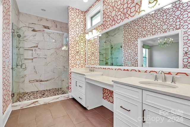 bathroom with tile patterned floors, a shower with door, and vanity