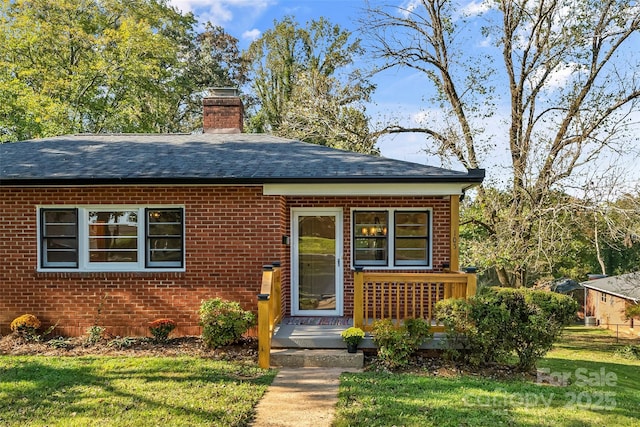 bungalow-style house featuring a front yard