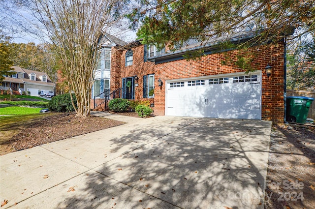 view of front of property with a garage