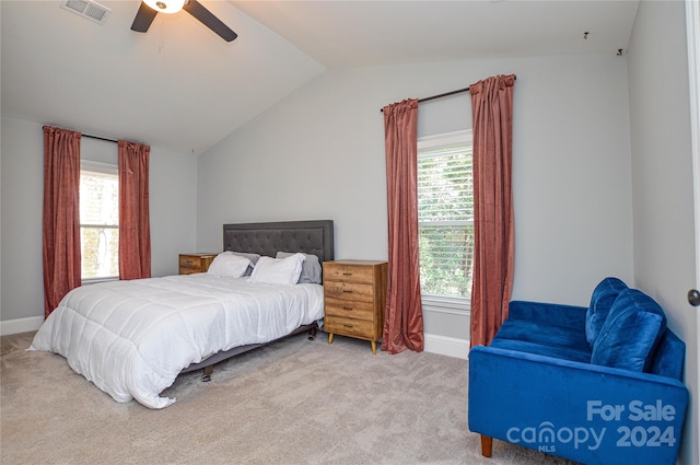 carpeted bedroom with vaulted ceiling and ceiling fan