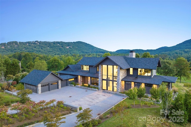 exterior space featuring a garage and a mountain view