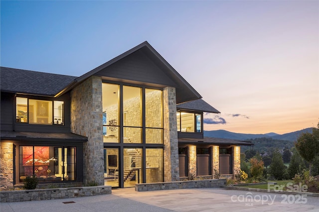 view of front of house featuring a patio area and a mountain view