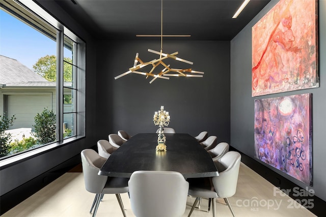 dining area with an inviting chandelier