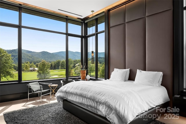 bedroom featuring a mountain view