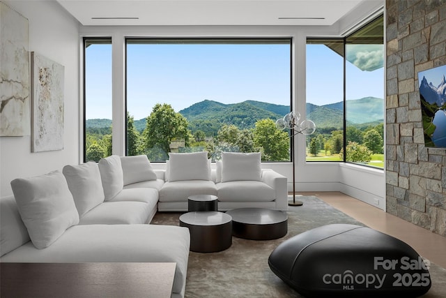 living room with hardwood / wood-style flooring and plenty of natural light