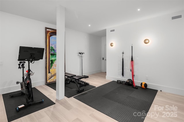 exercise area featuring light wood-type flooring