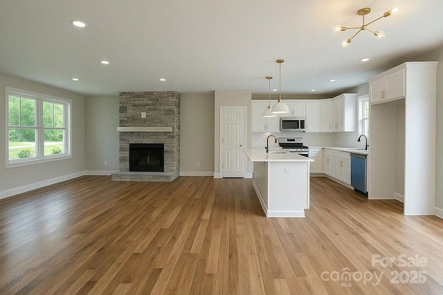 1710 Plantation Loop, Morganton, NC 28655 - kitchen featuring light countertops, stainless steel appliances, open floor plan, and a sink