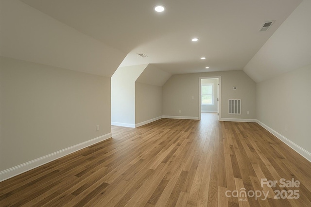 1710 Plantation Loop, Morganton, NC 28655 - additional living space featuring lofted ceiling, recessed lighting, visible vents, and wood finished floors