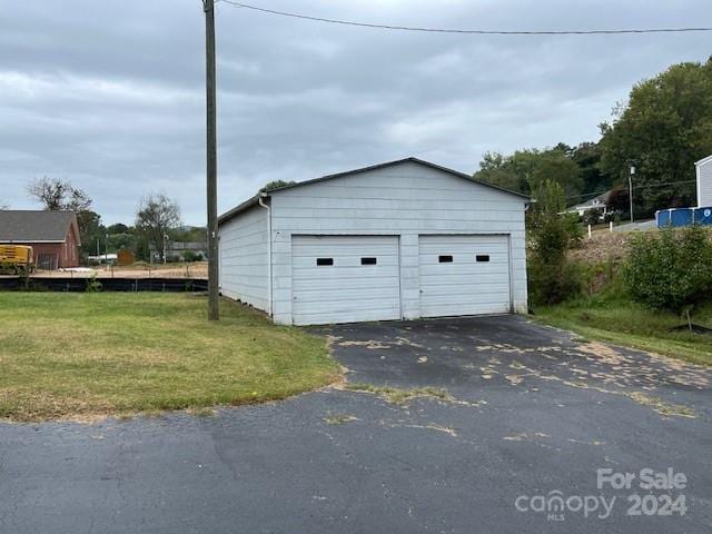 garage featuring a yard