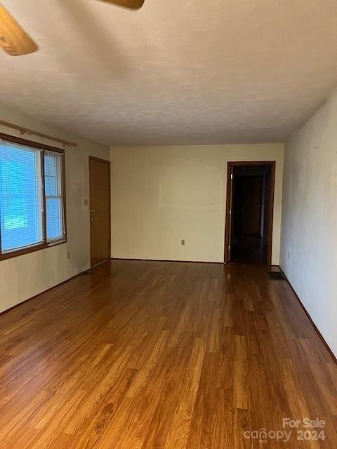 empty room featuring wood-type flooring