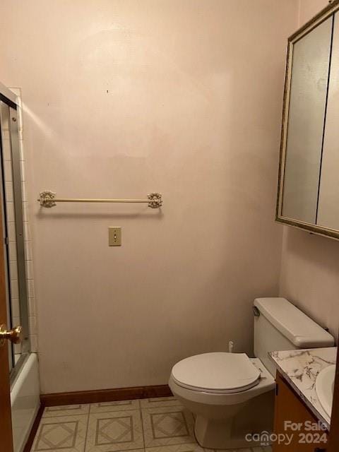 full bathroom with shower / bath combination with glass door, vanity, and toilet