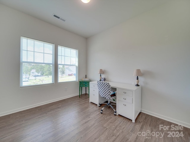 office area with light hardwood / wood-style floors