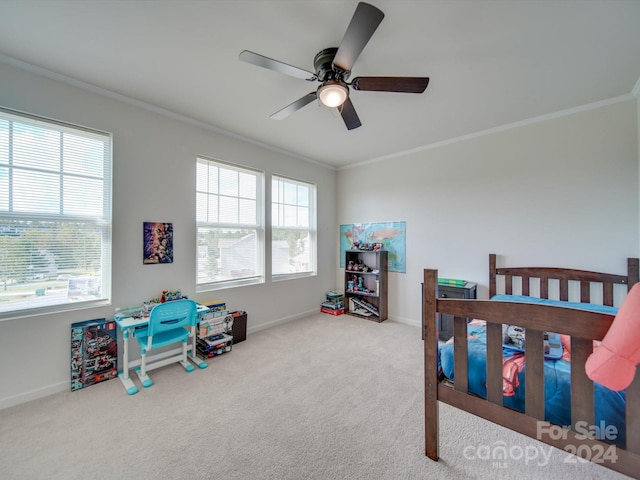 carpeted bedroom with ceiling fan, crown molding, and multiple windows