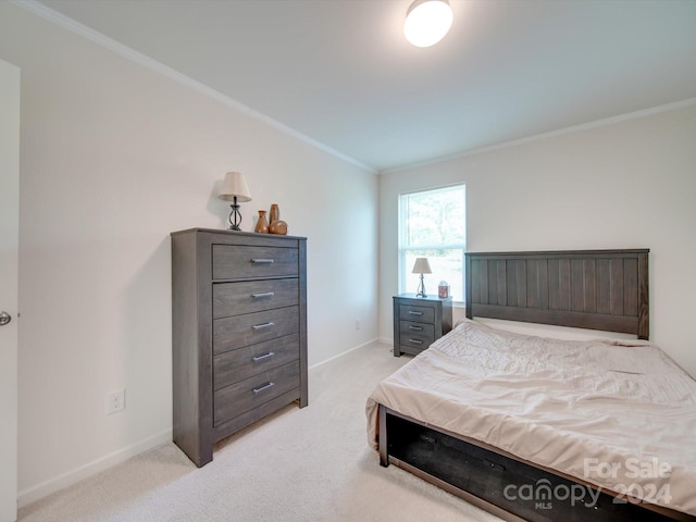 carpeted bedroom with crown molding