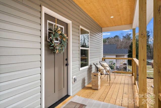 wooden terrace with a porch