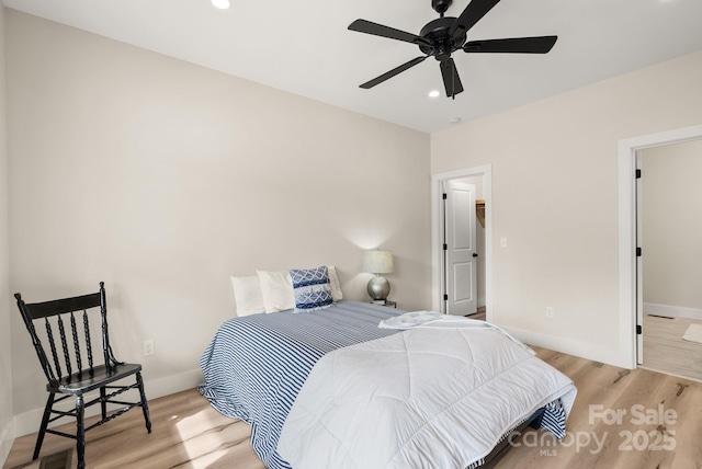 bedroom with ceiling fan, recessed lighting, light wood-style flooring, and baseboards