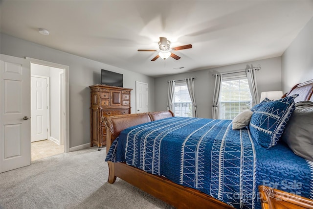 bedroom featuring ceiling fan, carpet floors, visible vents, and baseboards